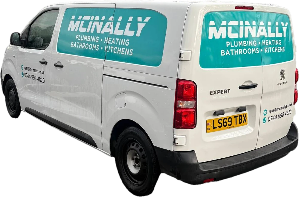 The McInally's Plumbing & Heating van, with the number to call on the side
